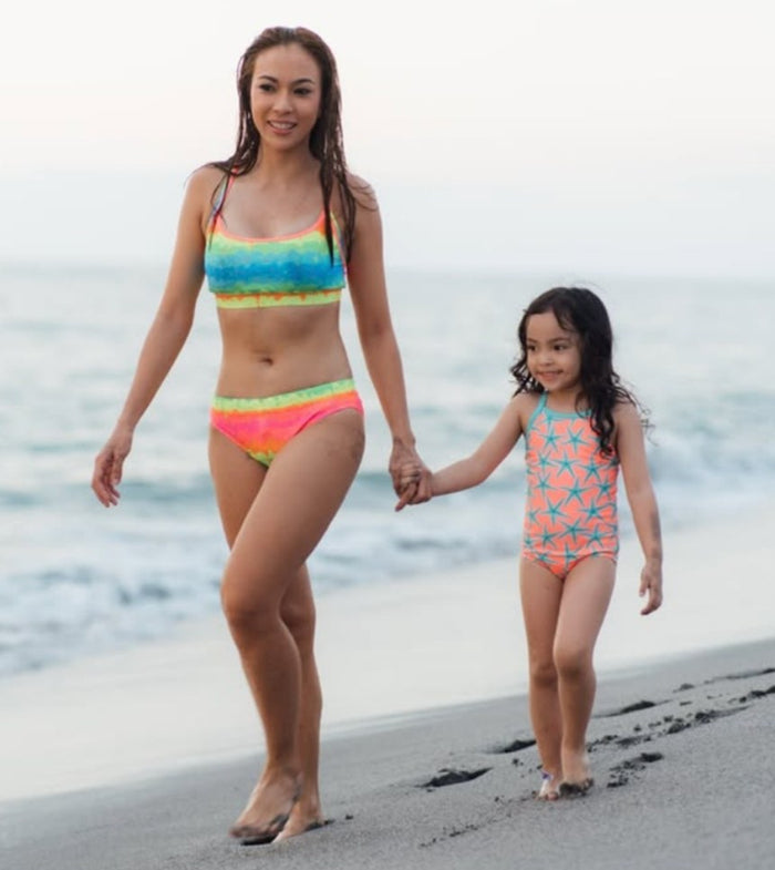 Faith and her niece in Funkita swimwear at the beach