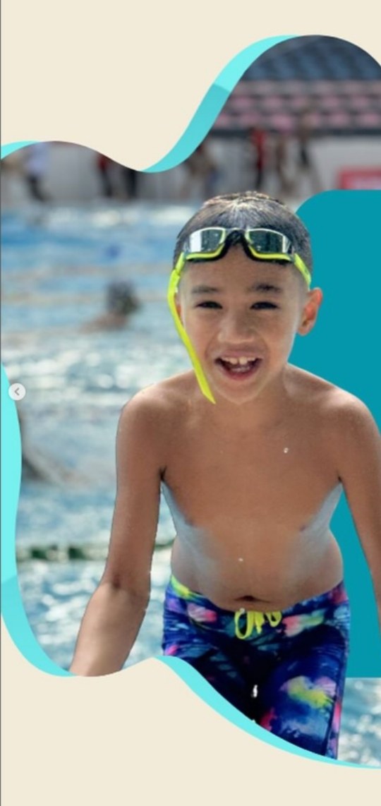 Mommy Em's son in Funky Trunks at a swim meet